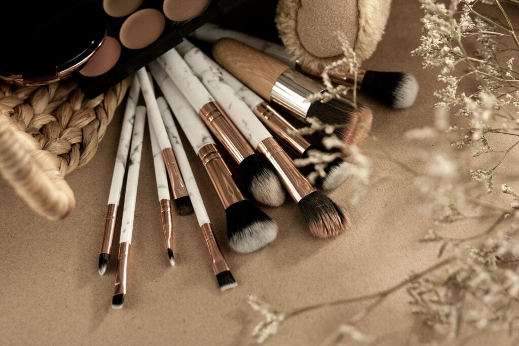 A large and messy set of makeup brushes